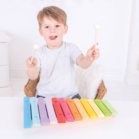 Child playing Wooden Xylophone