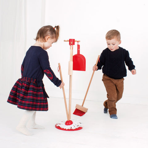 Toddlers playing with kids cleaning set