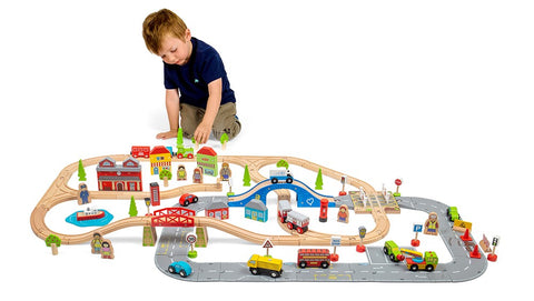 Boy playing with the City Road & Rail Set Christmas gift