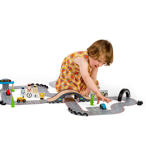 Girl playing with Roadway Race Day track 