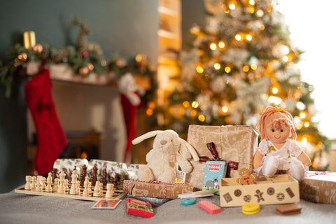 Collection of Bigjigs Toys by the Christmas tree