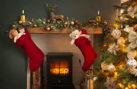 Family Christmas stockings above the fireplace