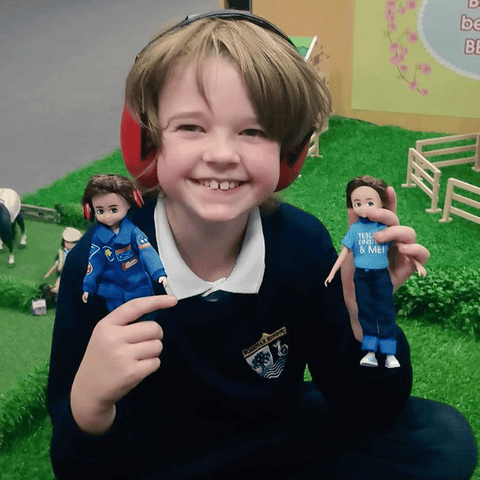 Young Hayden holding Loyal Companion Lottie Dolls