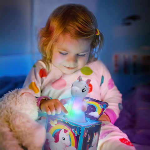 Girl holding Toy Unicorn Jack In The Box