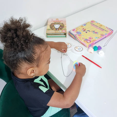 Girl playing with Jewellery Design Kit