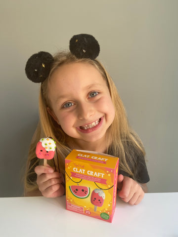 Girl with her jewellery making kit on World Kindness Day