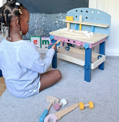 Girl using Wooden Tool Bench