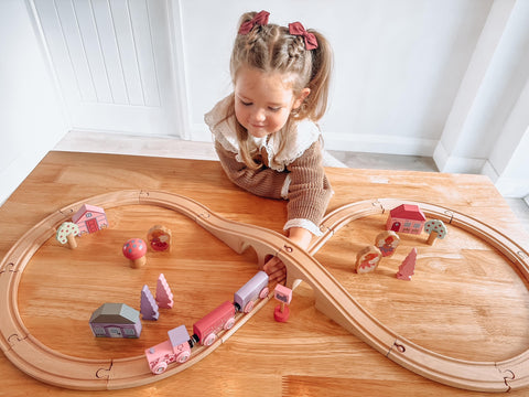 Fairy toys: Girl playing with Fairy Figure of Eight Train Set