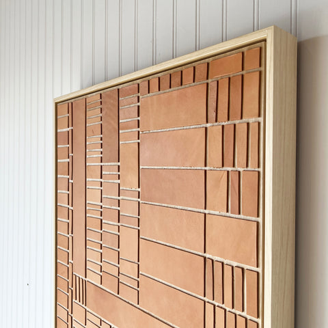 natural leather and wood geometric abstract art created by Los Angeles based artist Angie Johnson