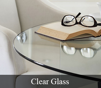 Clear Glass Table Top with a pair of glasses on top of a book sitting on the table