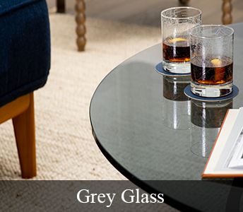 Grey Glass Table Top with two half-filled glasses on coasters sitting on table