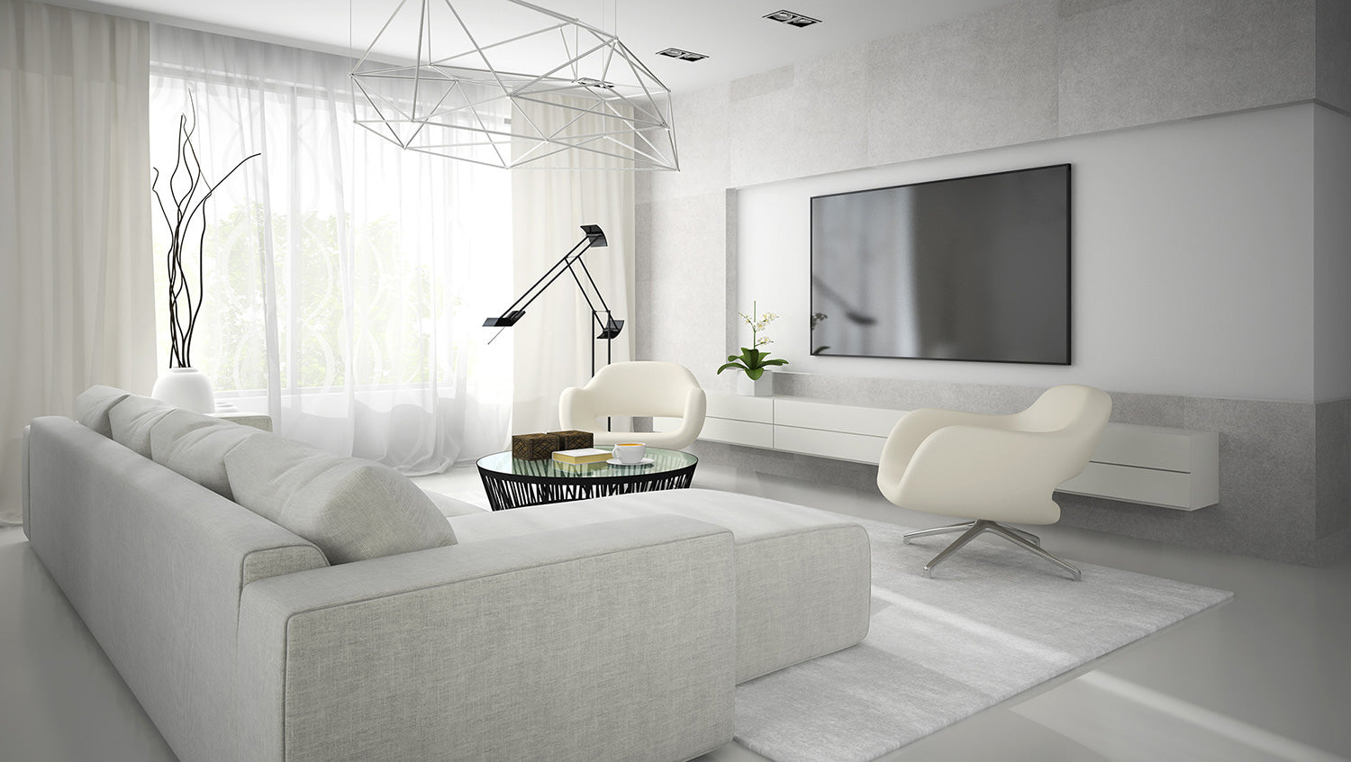 Round clear glass table in front of light grey couch all facing television set