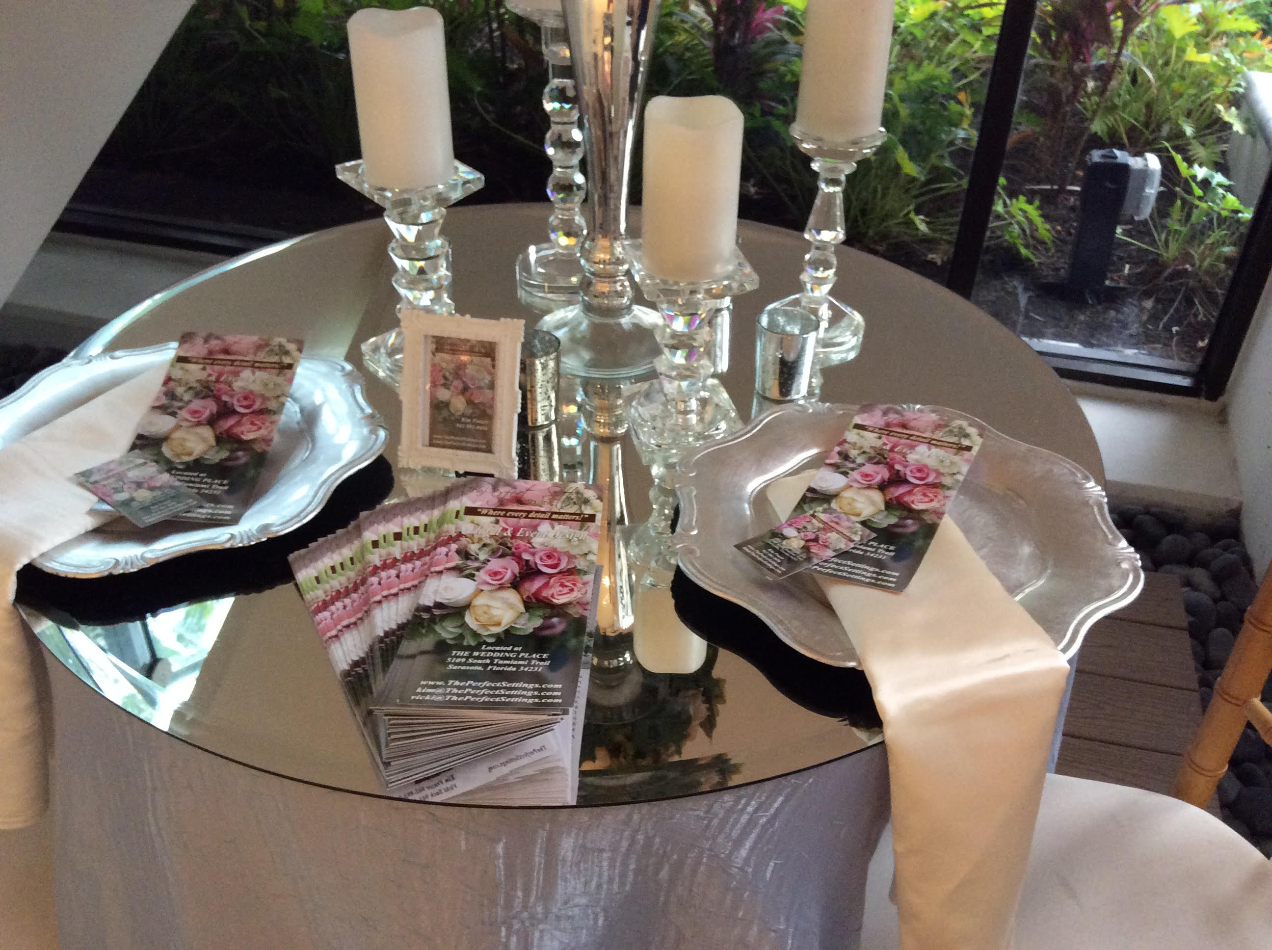 Mirror Glass Table Top with silver shaped plates.