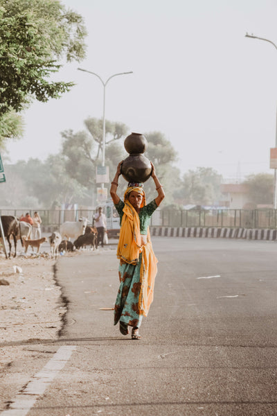 Indian lady with pot on her head