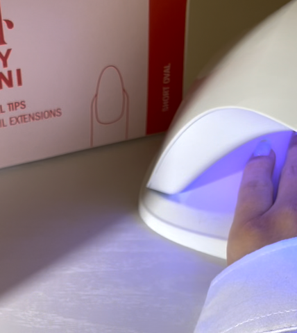 Nails Curing Under UV Nail Lamp