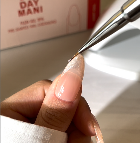 'Candlelight' application to nail with nail art liner brush