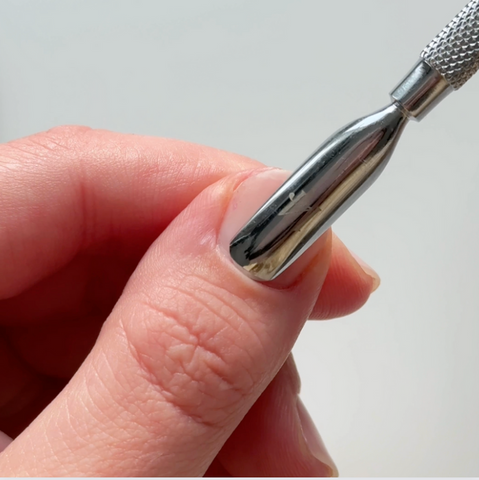 Prepping Nail Bed with Cuticle Pusher