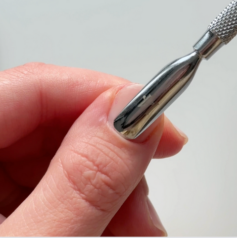 Prepping bare nail with cuticle pusher