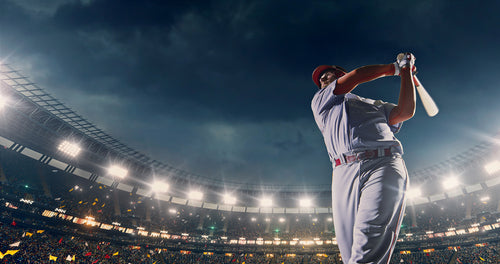 baseball player hitting ball