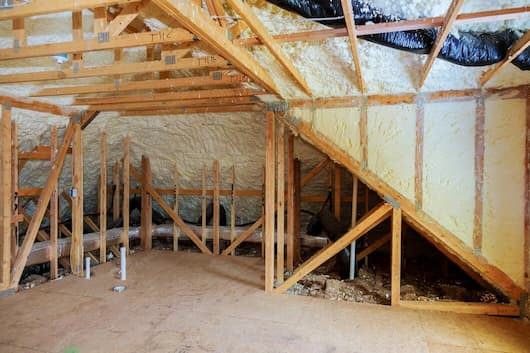 inside attic heat isolation with spray foam wooden house building construction