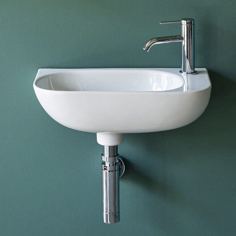 Cloakroom wall hung basin with bottle trap