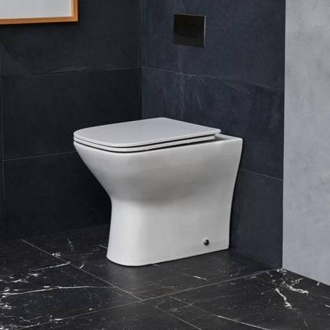 Compact back to wall toilets