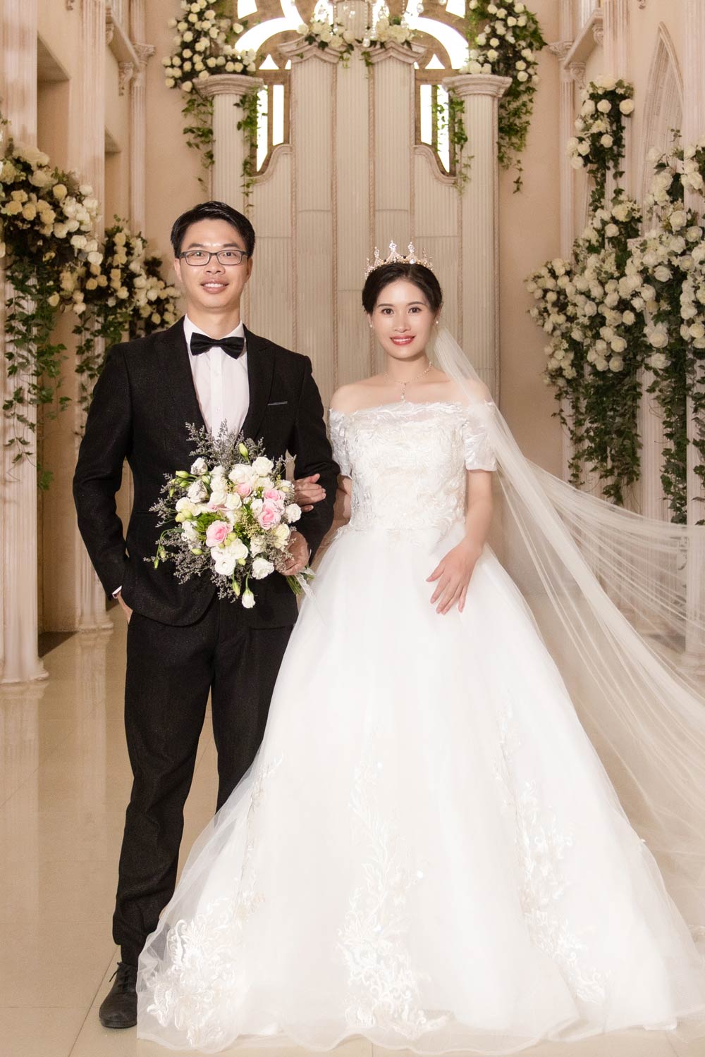 lynne and fred in wedding dresses in a church