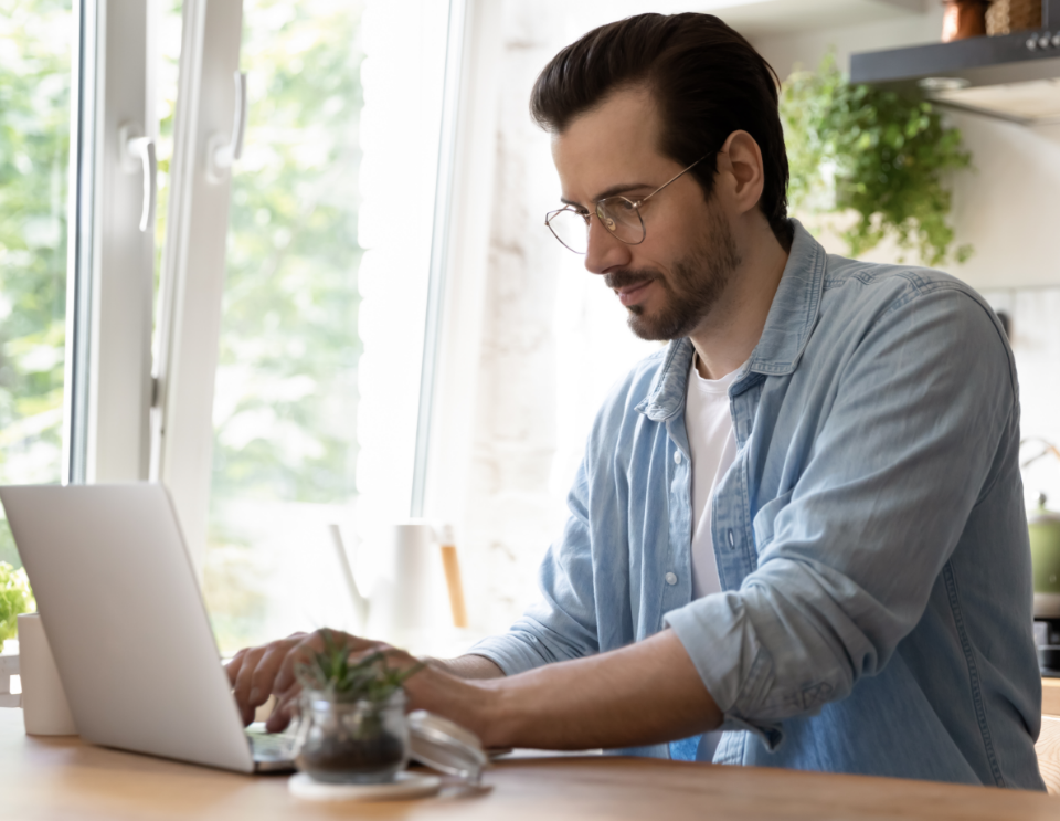 A man is working on his laptop.