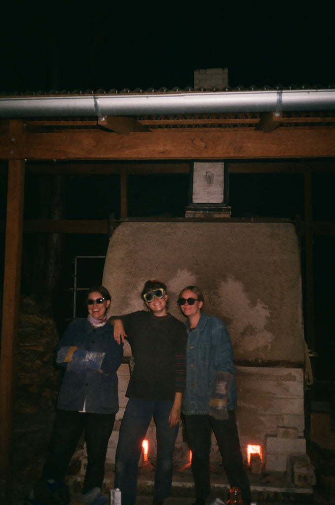 three proud women got the temperature of the kiln to the desired heat.