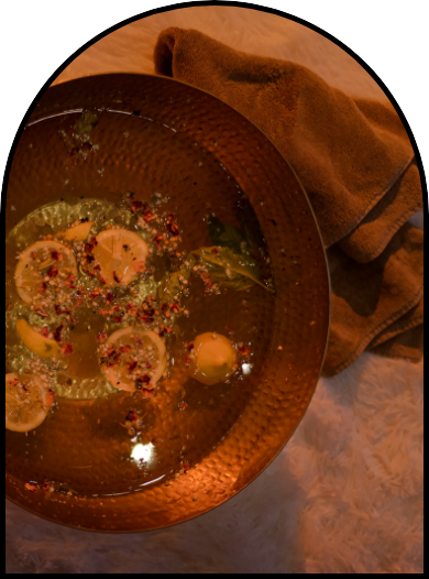 bucket of water with oils and plants