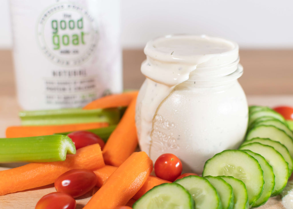 Ranch dressing with cucumbers, carrots, tomatoes, and celery together.
