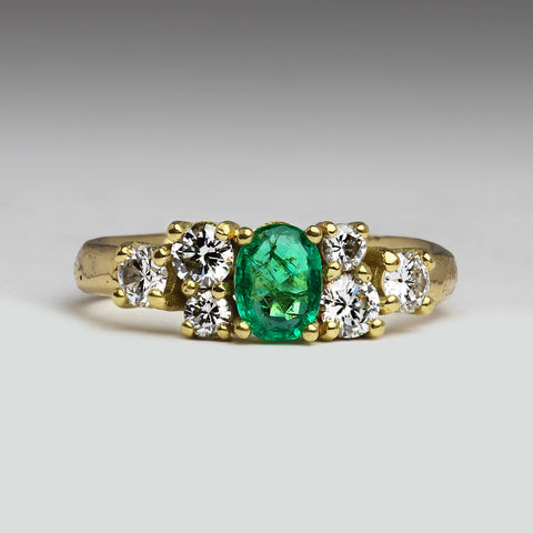 Emerald and diamond multi-stone engagement ring