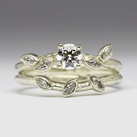 White gold diamond engagement ring with marquise diamonds set like falling leaves