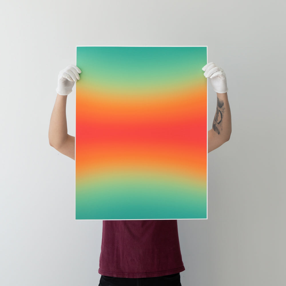 Person holding up a large colorful gradient poster in front of themselves.