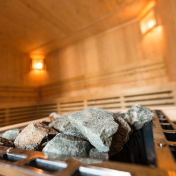 Interior of a sauna with sauna stones.