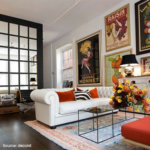 A home with French-themed posters in the living room