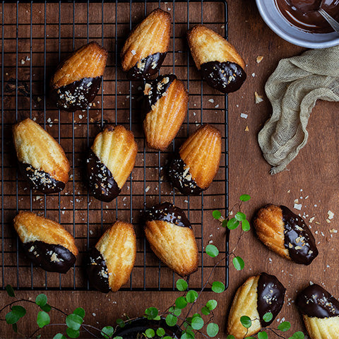 Image of a madeleine dipped in chocolate