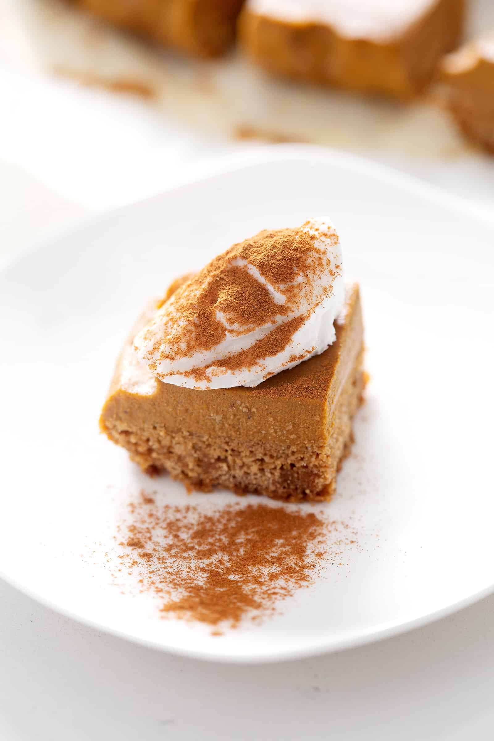 AIP Pumpkin Pie Square with frosting and dash of cinnamon