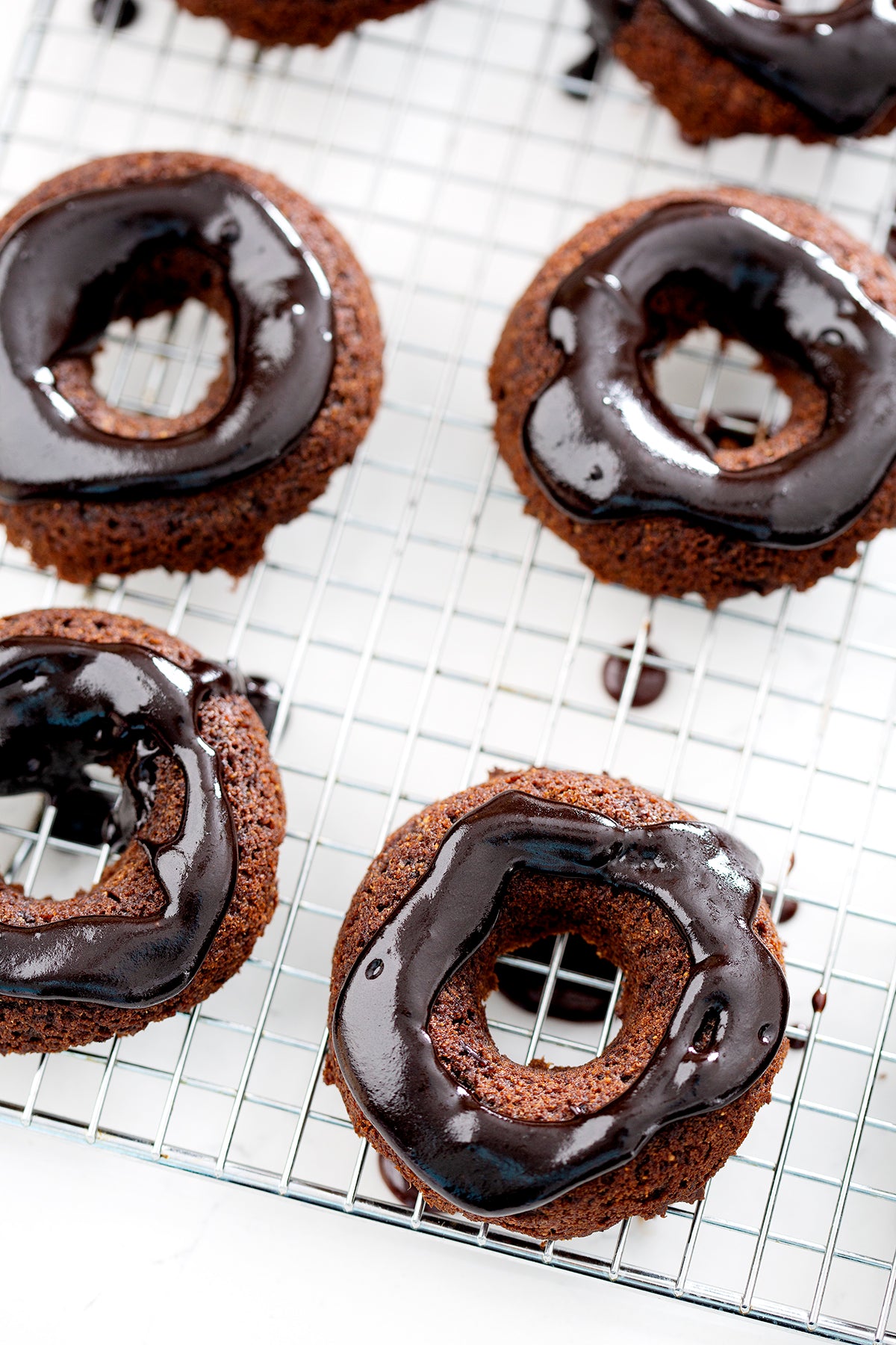 aip chocolate donuts on wire rack