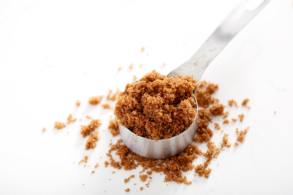 measuring cup of brown sugar