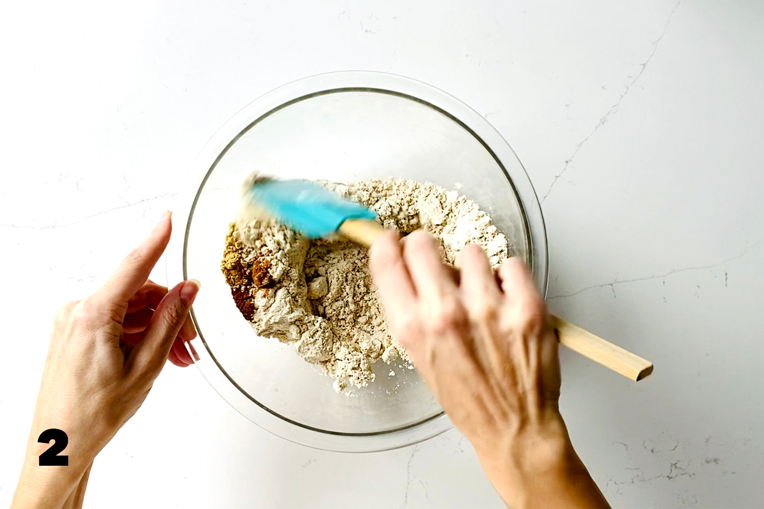 stirring dry ingredients in glass bowl