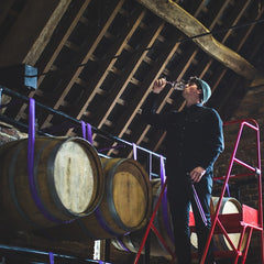 Tommy Grimshaw - Headwine maker at Langham tasting wine from barrels