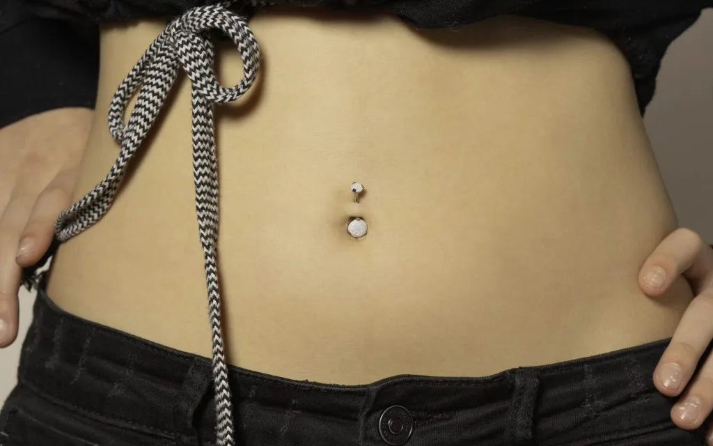 Signs your belly button piercing is healed.