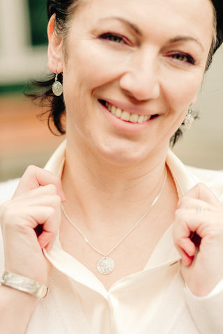 Model wearing business casual attire paired with sterling silver Bear jewellery. 