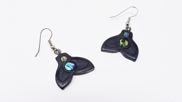 Argillite whale tail drop earrings with abalone featured in the earrings.