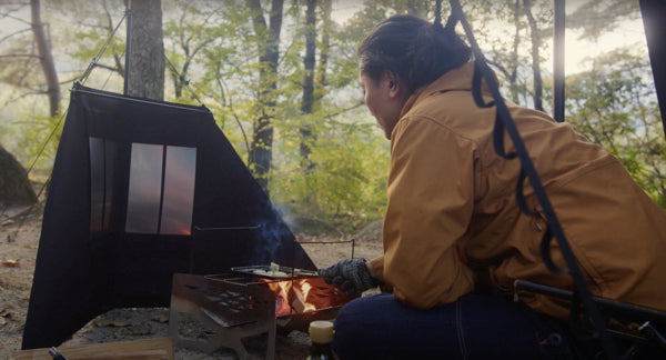 A man enjoys cooking on a bonfire McCrite