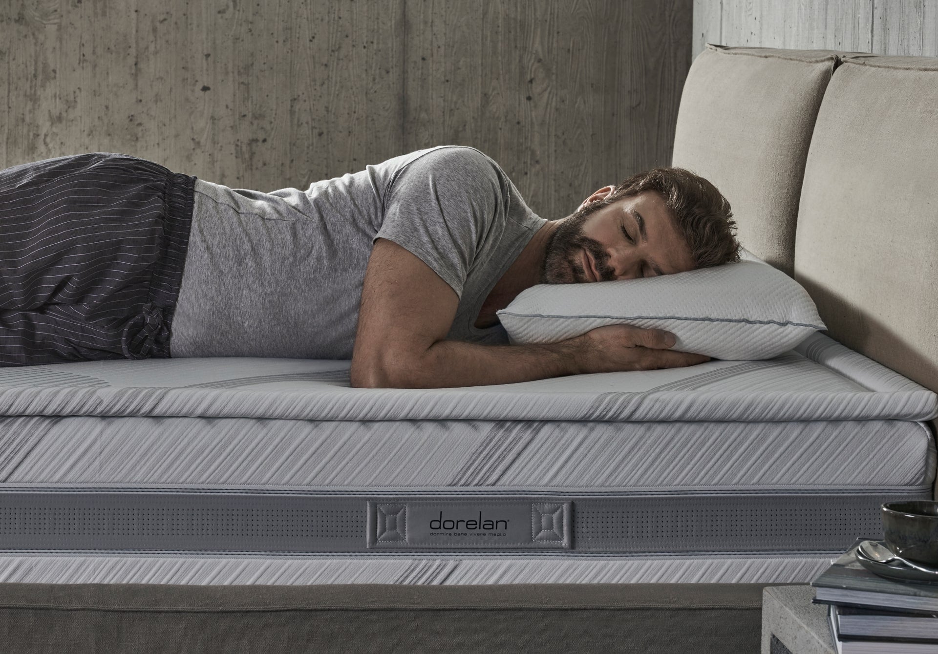 On a Dorelan bed, a man sleeps comfortably looking and sleeping sideways.