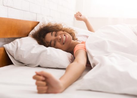 woman waking up after a restful sleep