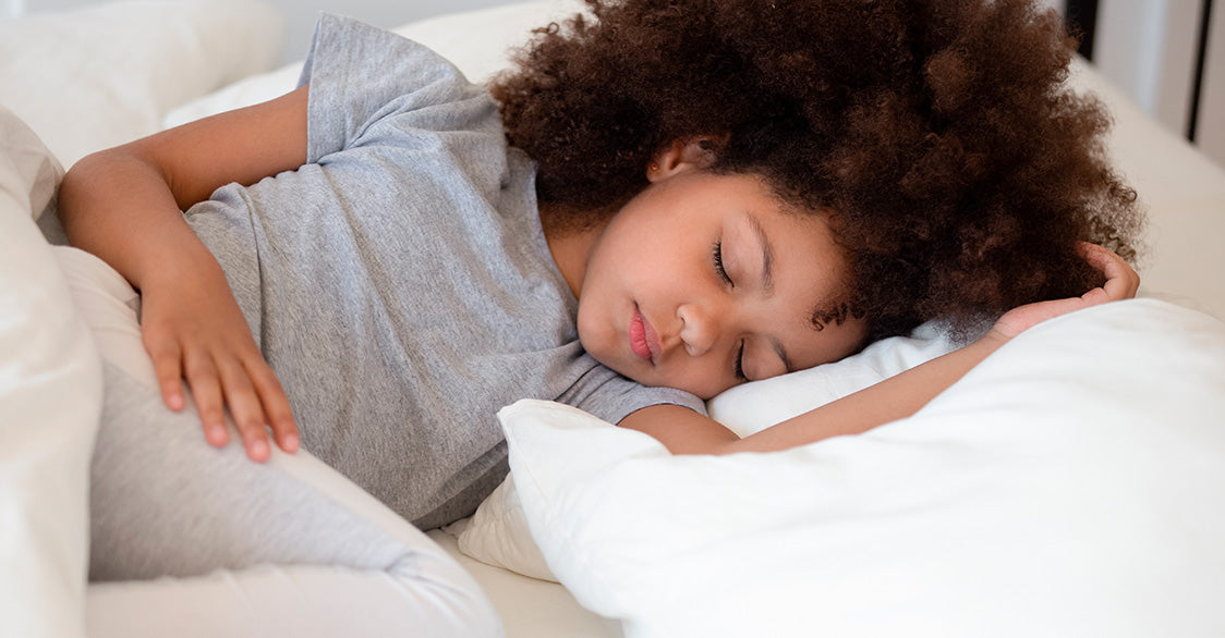Young girl quietly sleeping looking peaceful and comfortable