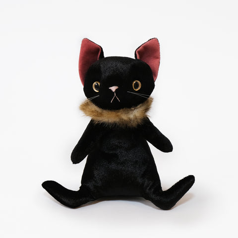 A stylish stuffed cat with a stylish fur around its neck. Color is black.